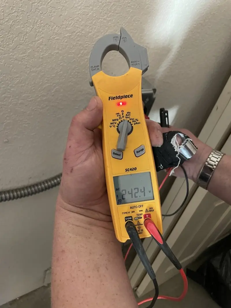 Voltage testing with clamp meter during Ceiling Fan Installation in North Greenbush